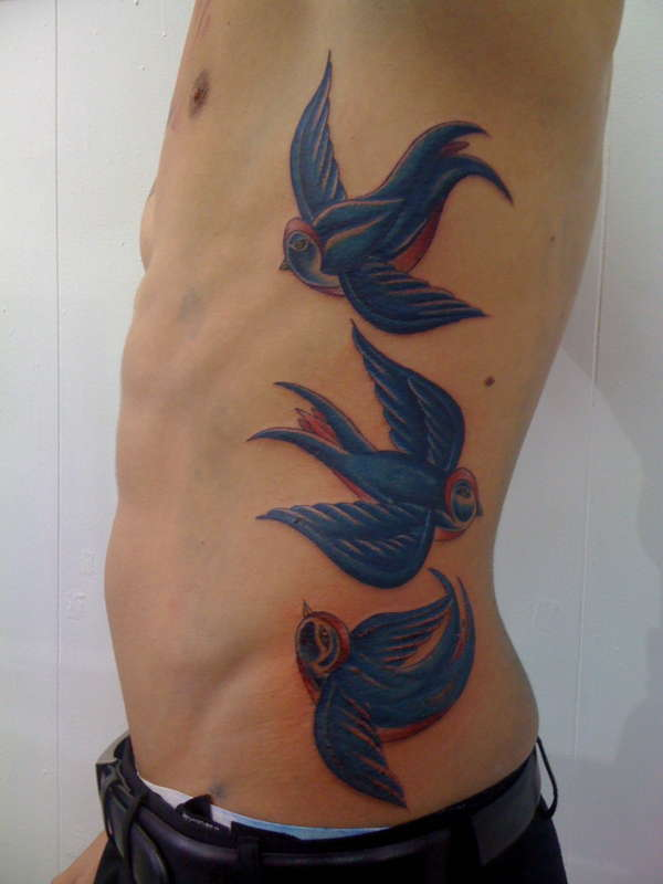 bird rib tattoos for men